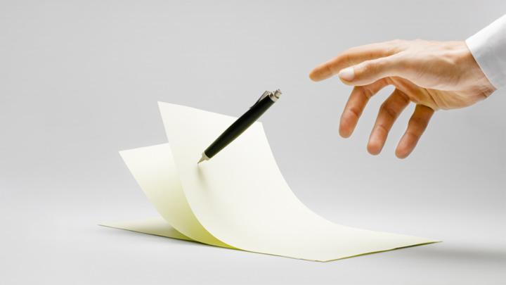 A levitating pen touches papers