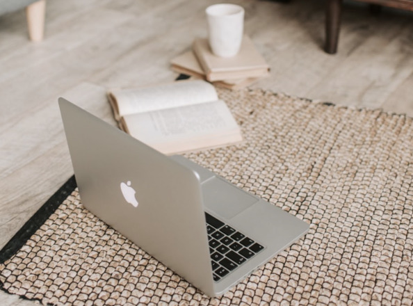 A laptop and a book