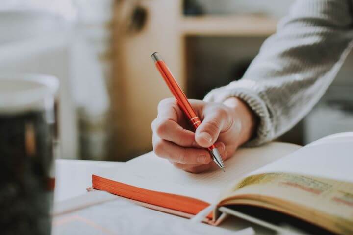 A person holding a pen